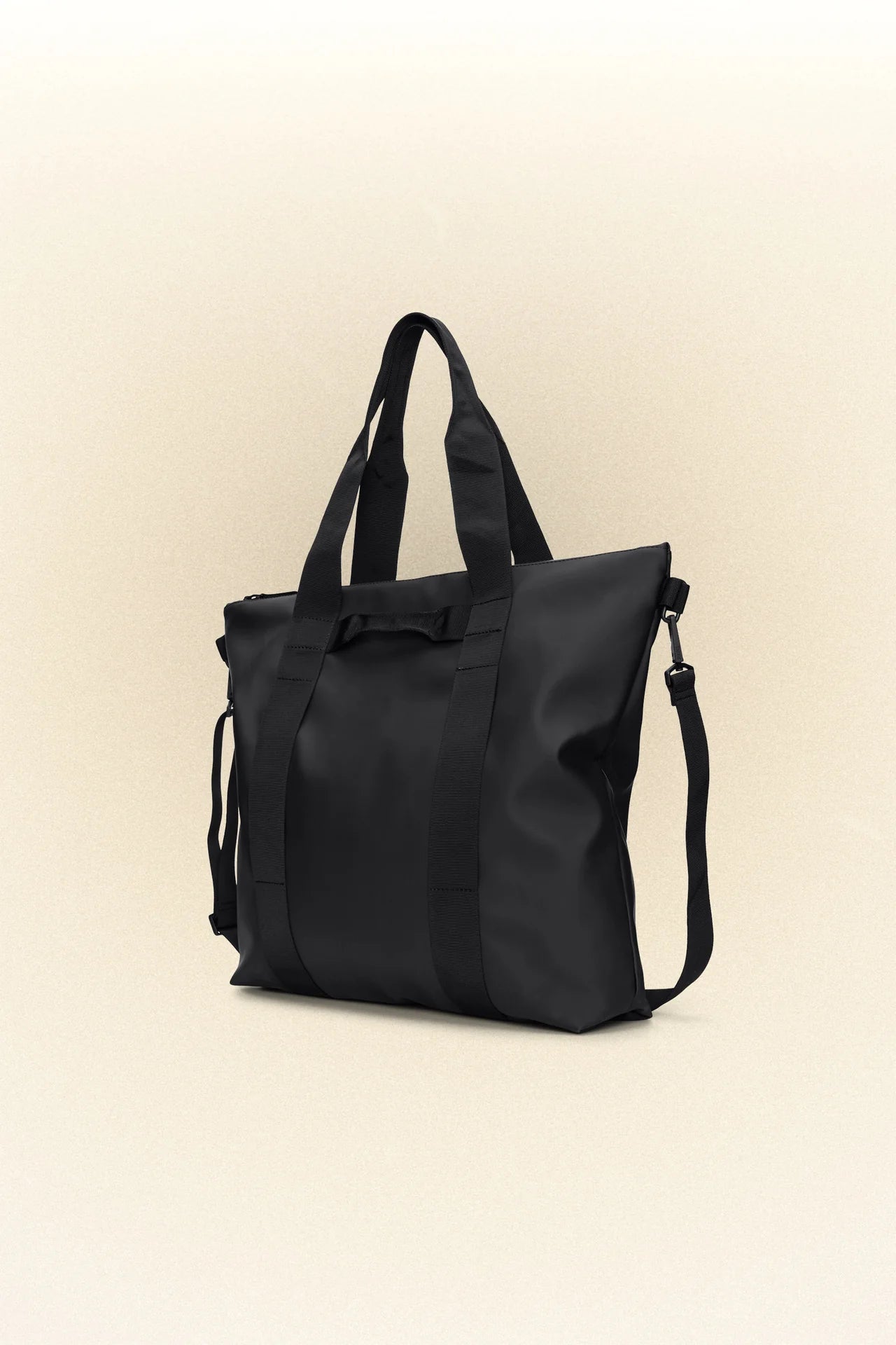 A Rains waterproof Tote Bag - Black on a white background.