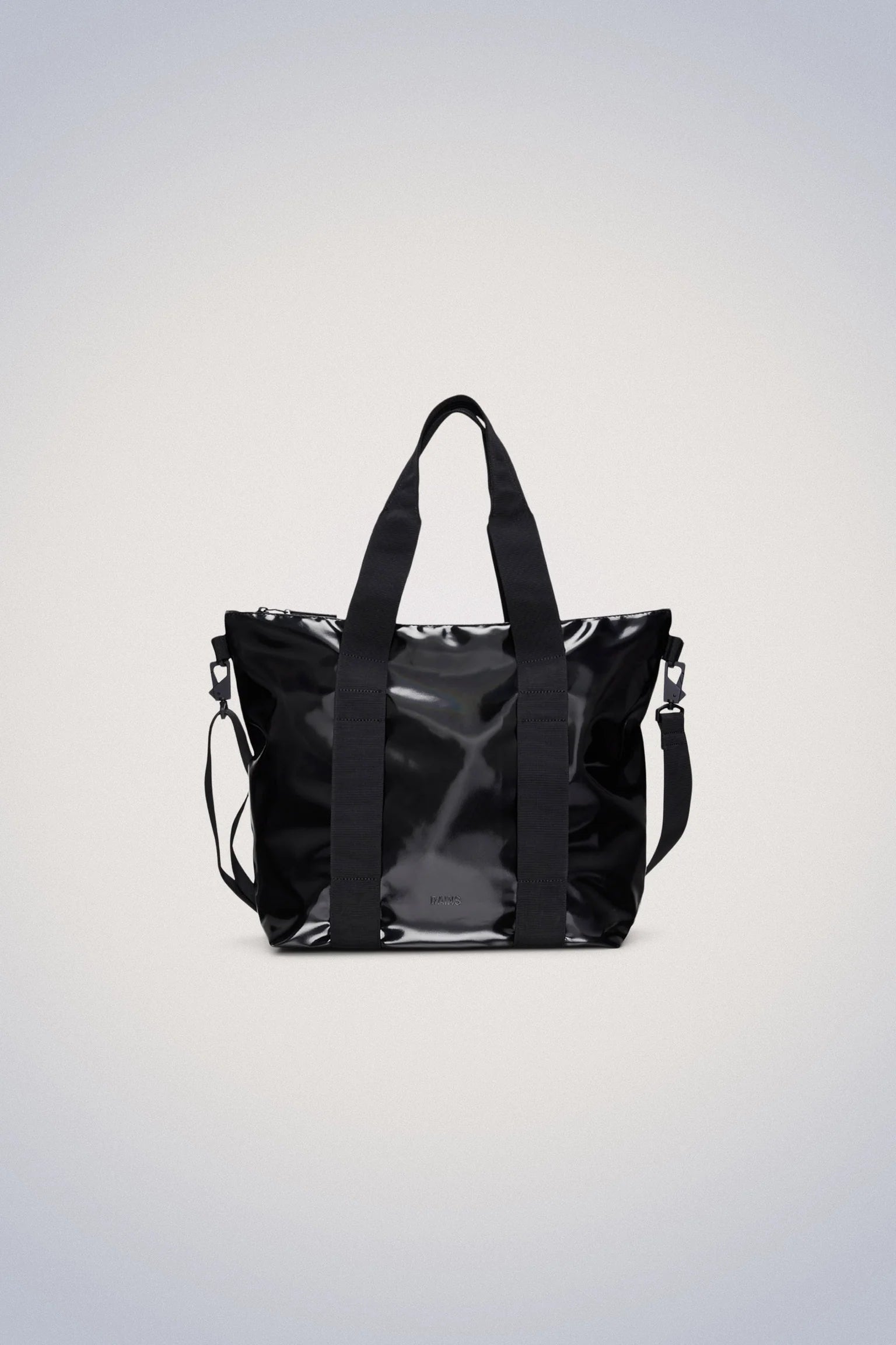 A Tote Bag Mini - Night by Rains on a white background, featuring a detachable strap and made from durable materials. The bag has reinforced stitching for added durability and interior pockets for plenty of storage space. Perfect.