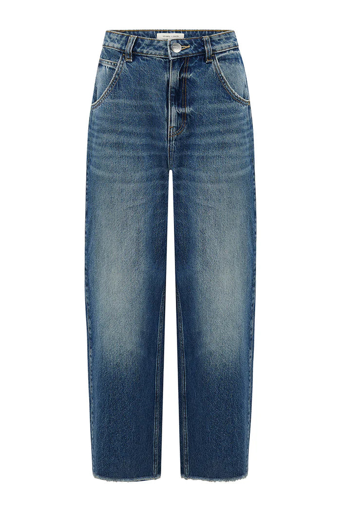 The Bo Barrel Leg Jeans - Phoenix by Seventy & Mochi are super high-rise, straight-leg blue jeans in rigid denim with a button and zipper closure, front pockets, and a slightly faded wash.