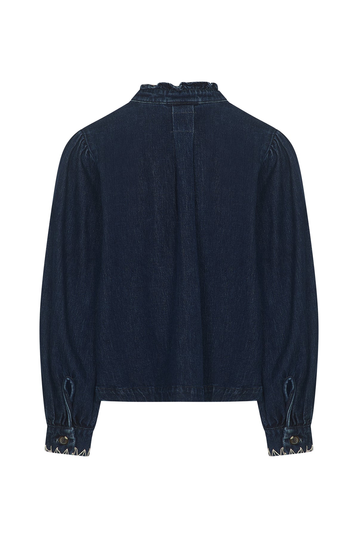 Back view of the Seventy & Mochi Ziggy Jacket - Americana, a long-sleeve, dark blue denim blouse with a ruffled collar and buttoned cuffs, made from organic cotton for a soft, sustainable feel. The relaxed-fit jacket is displayed on a white background.