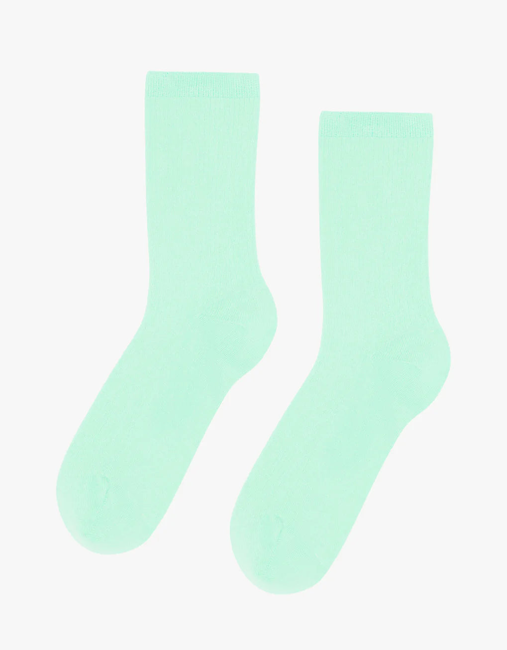 A pair of Colorful Standard Classic Organic Socks in a mint green color on a white background. The socks are anti-pilling, seamless, and breathable.