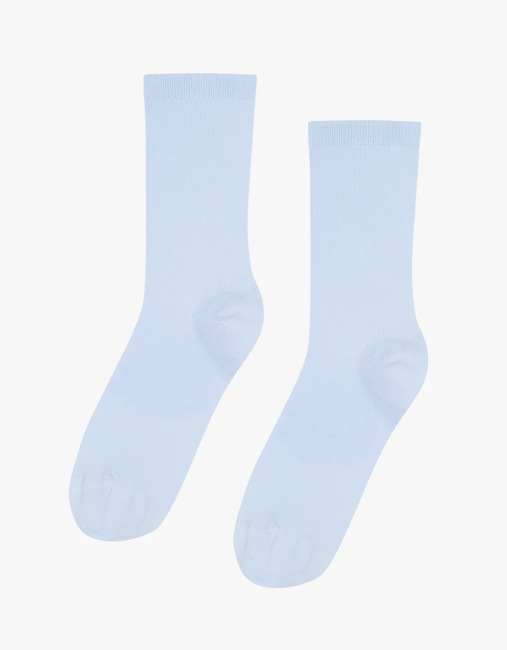 A pair of Classic Organic Socks by Colorful Standard in light blue on a white background.