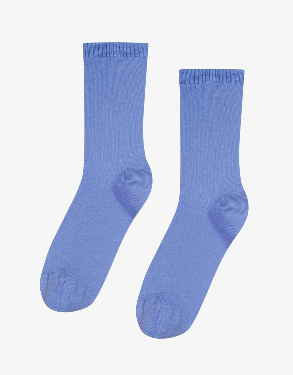 A pair of Colorful Standard Classic Organic Socks in a vibrant blue color, set against a clean white background. These breathable and seamless socks offer optimal comfort and style.