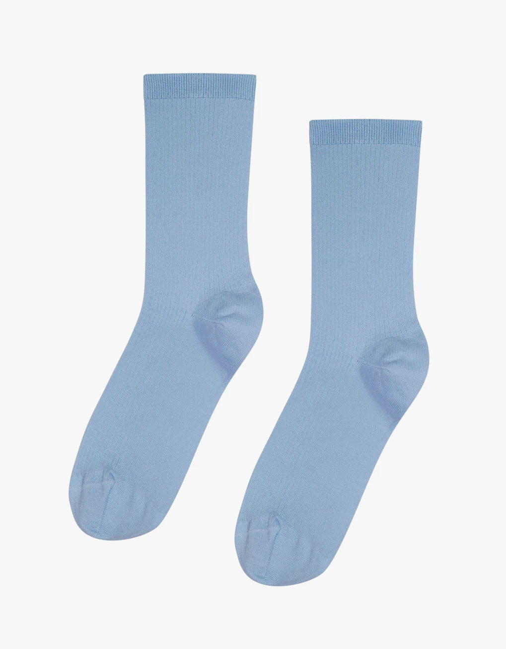 A pair of Classic Organic Socks by Colorful Standard, in light blue, on a white background.