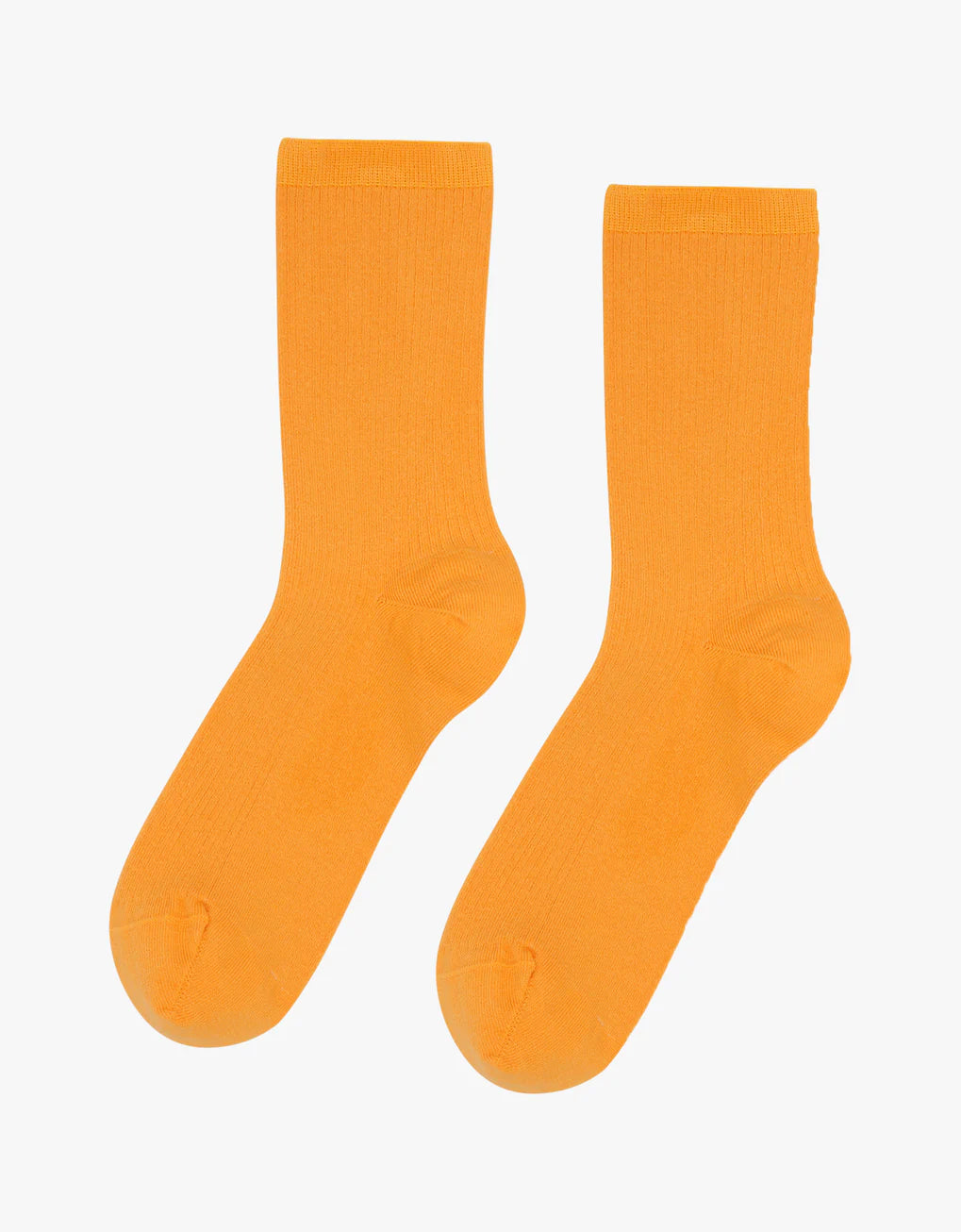 A pair of seamless and breathable Colorful Standard Classic Organic Socks on a white background.