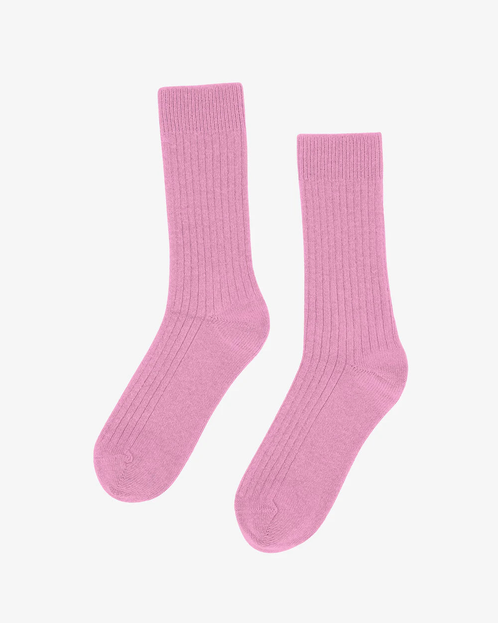 A pair of Merino Wool Blend Socks by Colorful Standard in light pink, featuring a ribbed crew design and made from soft recycled wool, laid flat on a white background.