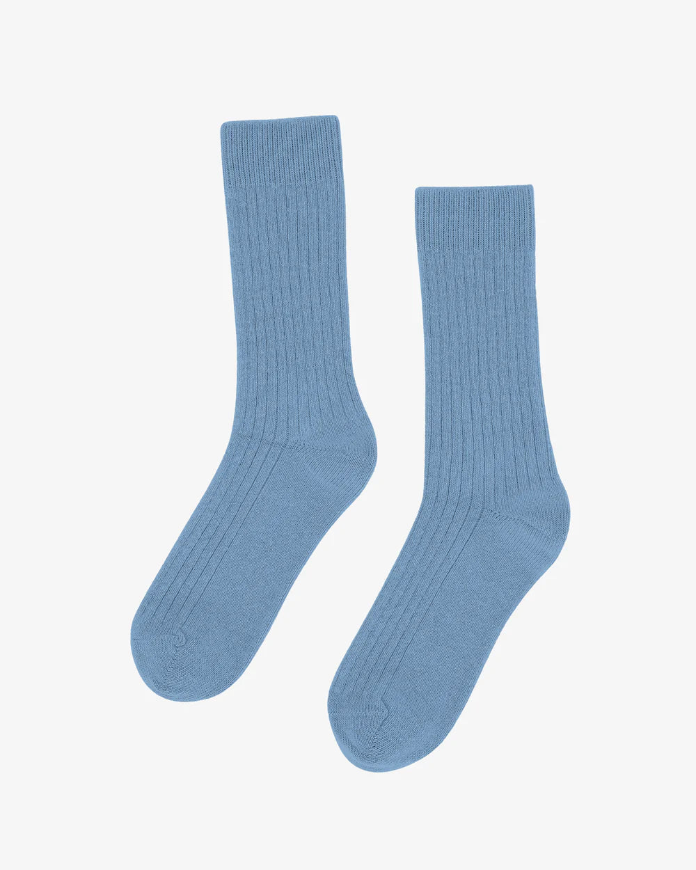 The Colorful Standard Merino Wool Blend Sock, shown in light blue with a ribbed crew design and made from recycled wool, is displayed on a plain white background.