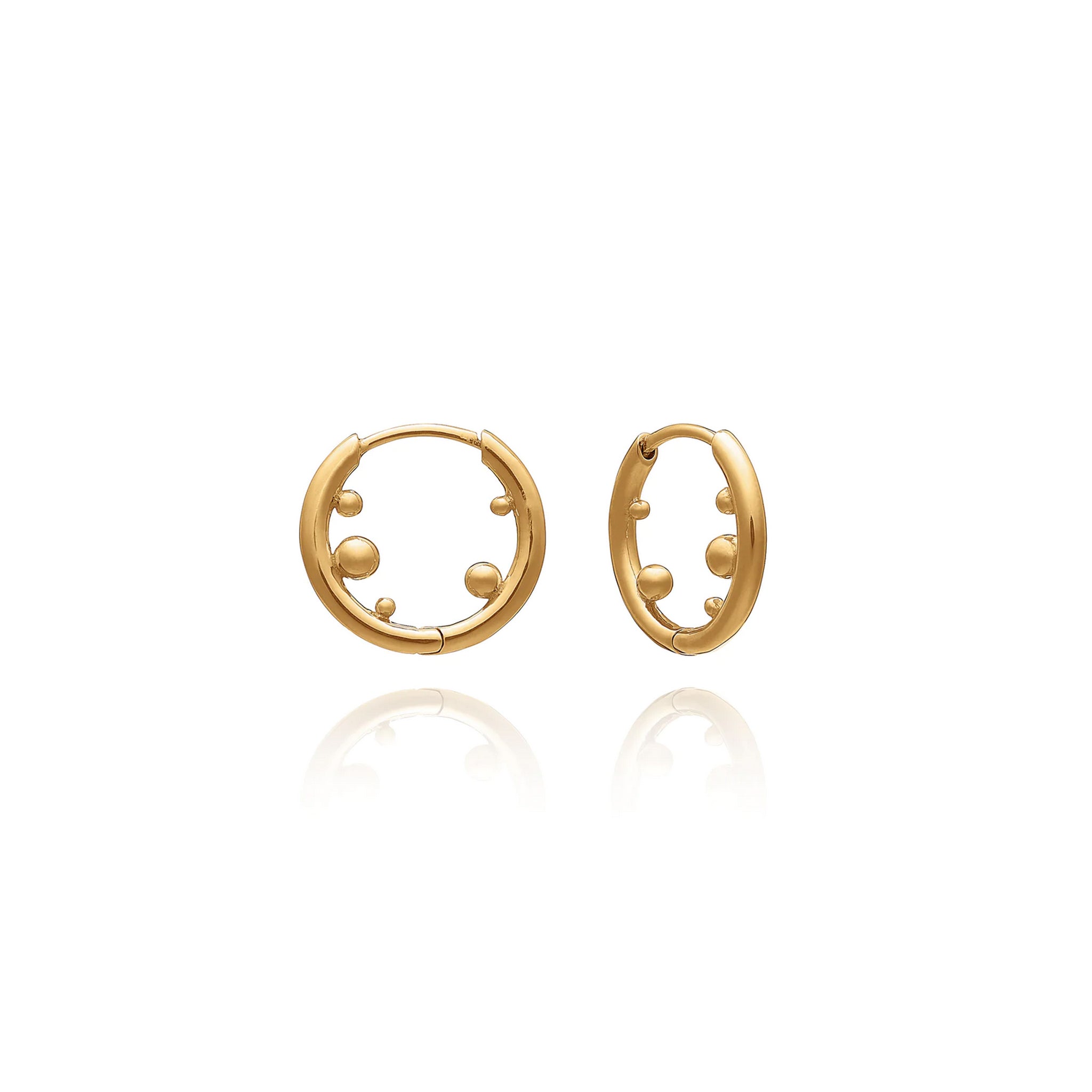 A pair of Stellar Orb Huggie Hoops - Gold by Rachel Jackson London on a white background.