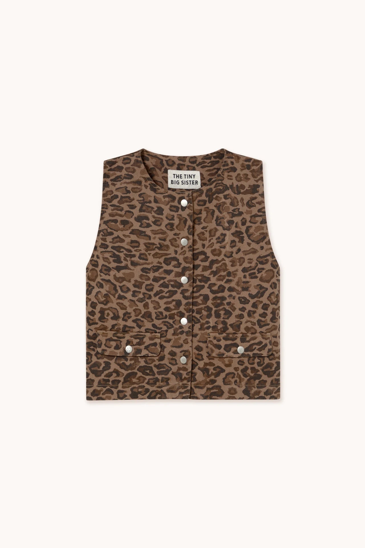 The Tiny Big Sister Animal Print Vest - Mocha features a brown animal print, sleeveless design, silver snap buttons, and two front pockets, shown flat on a light background.