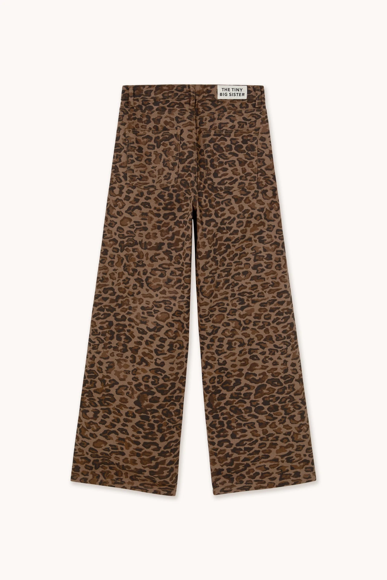 The Berta Animal Print Jeans - Mocha by Tiny Big Sister feature a bold brown and black leopard print, two back pockets, and a small white waistband label—perfect for standout style.