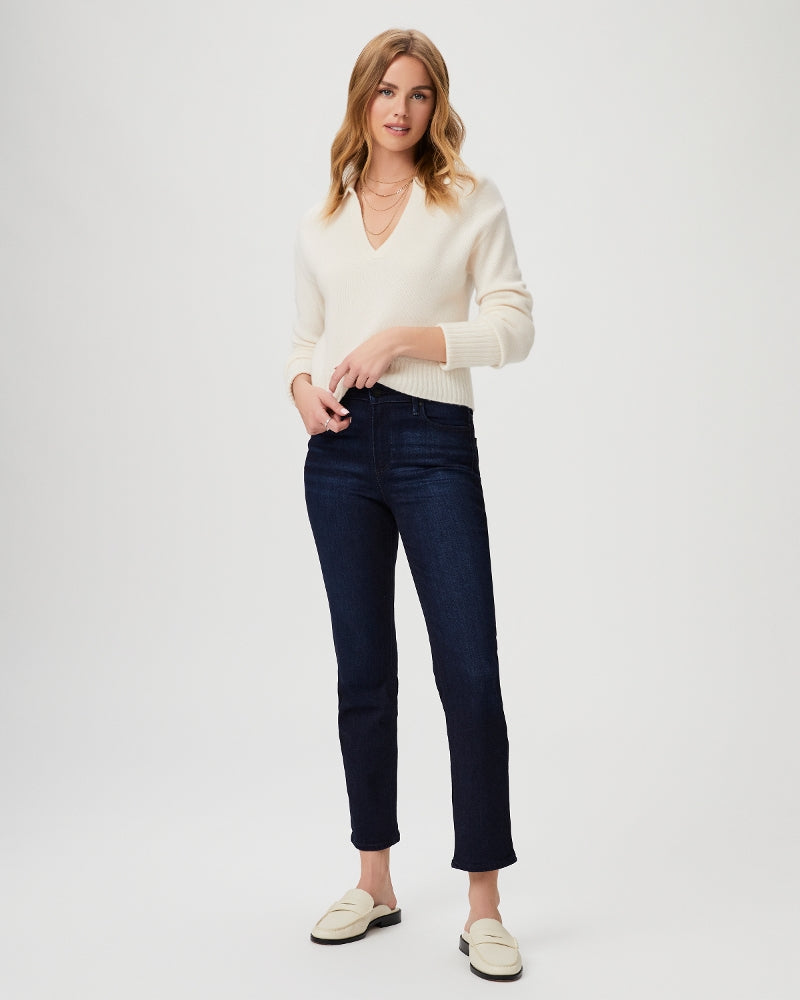 blonde model wearing blue slim leg high waisted jeans