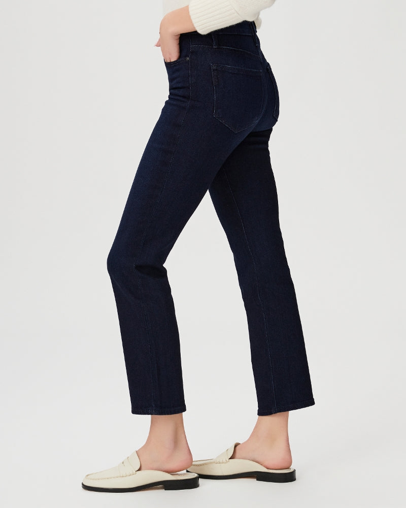 side view blonde model wearing blue slim leg high waisted jeans