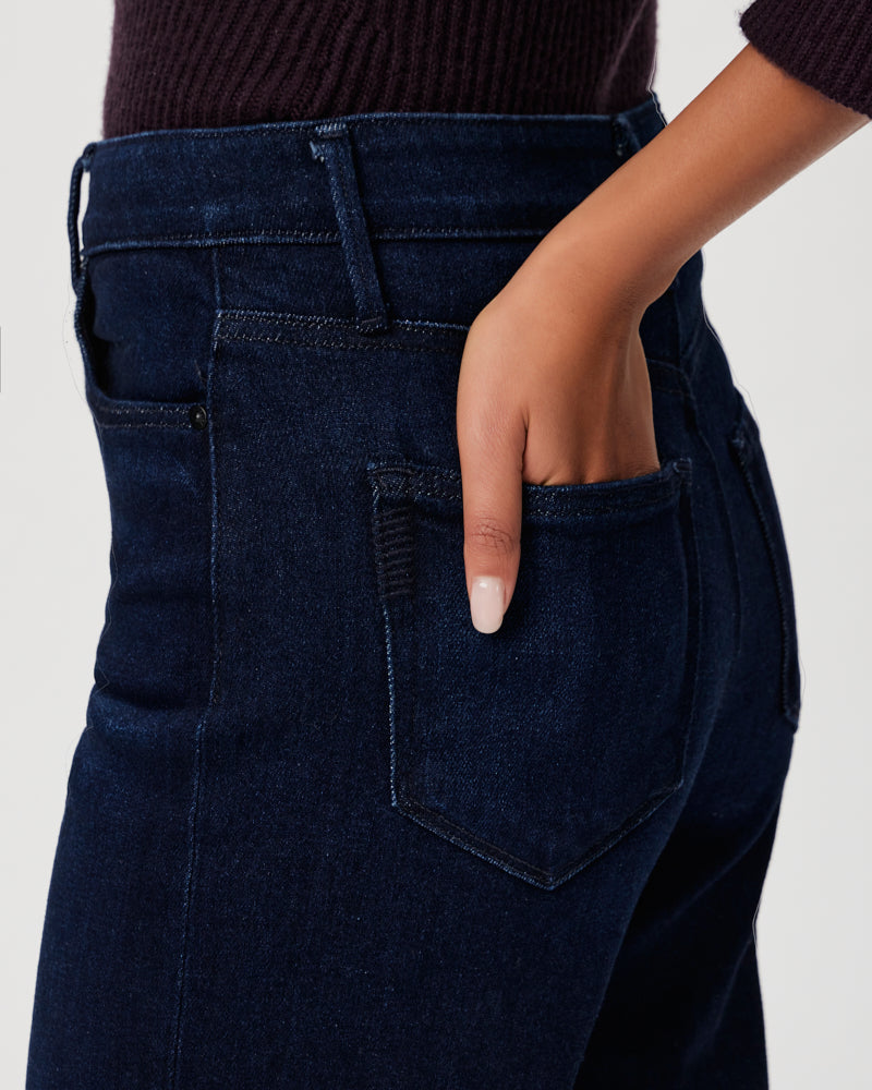The ultra high-waisted back pocket of a woman's Paige Anessa Wide Leg - Sussex vintage denim jeans.