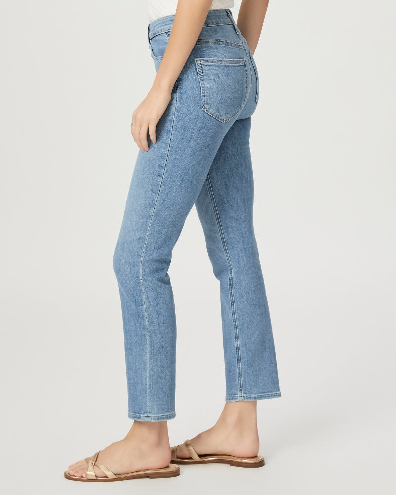 model wears slim leg paige jeans in golden age light blue