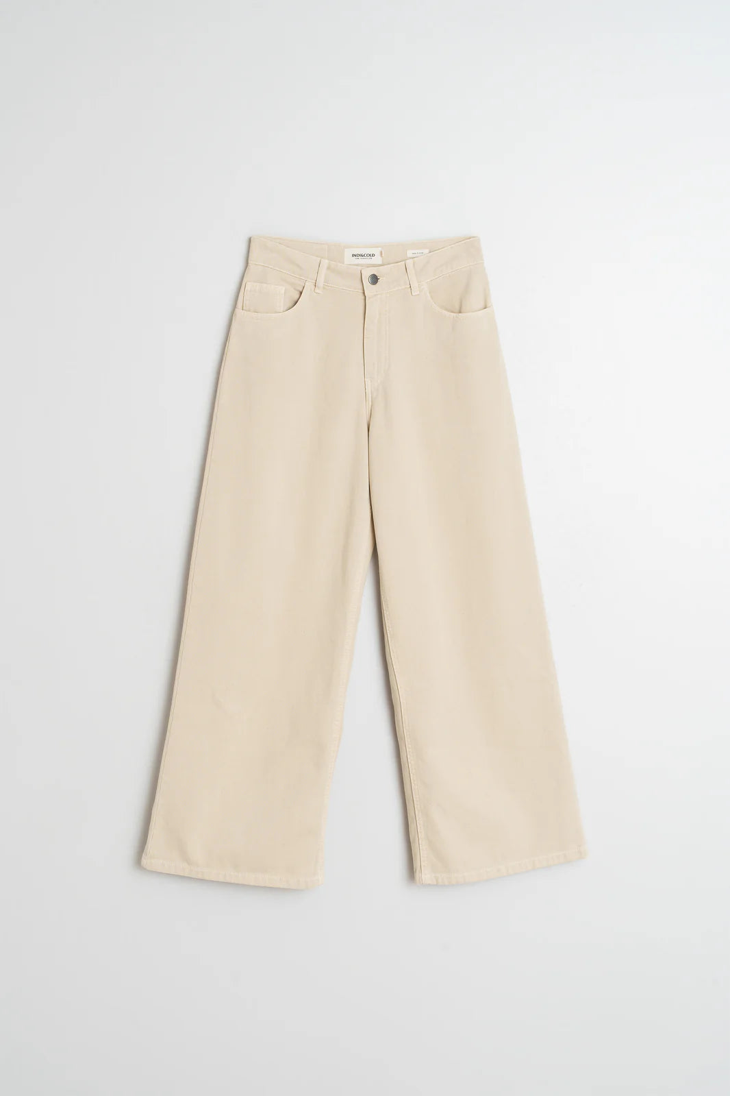 Indi & Cold's Wide Twill Trousers - Cream feature a high waist, front button and zipper closure, five pockets, and a wide-leg cut—crafted from cotton twill and shown flat on a white background.