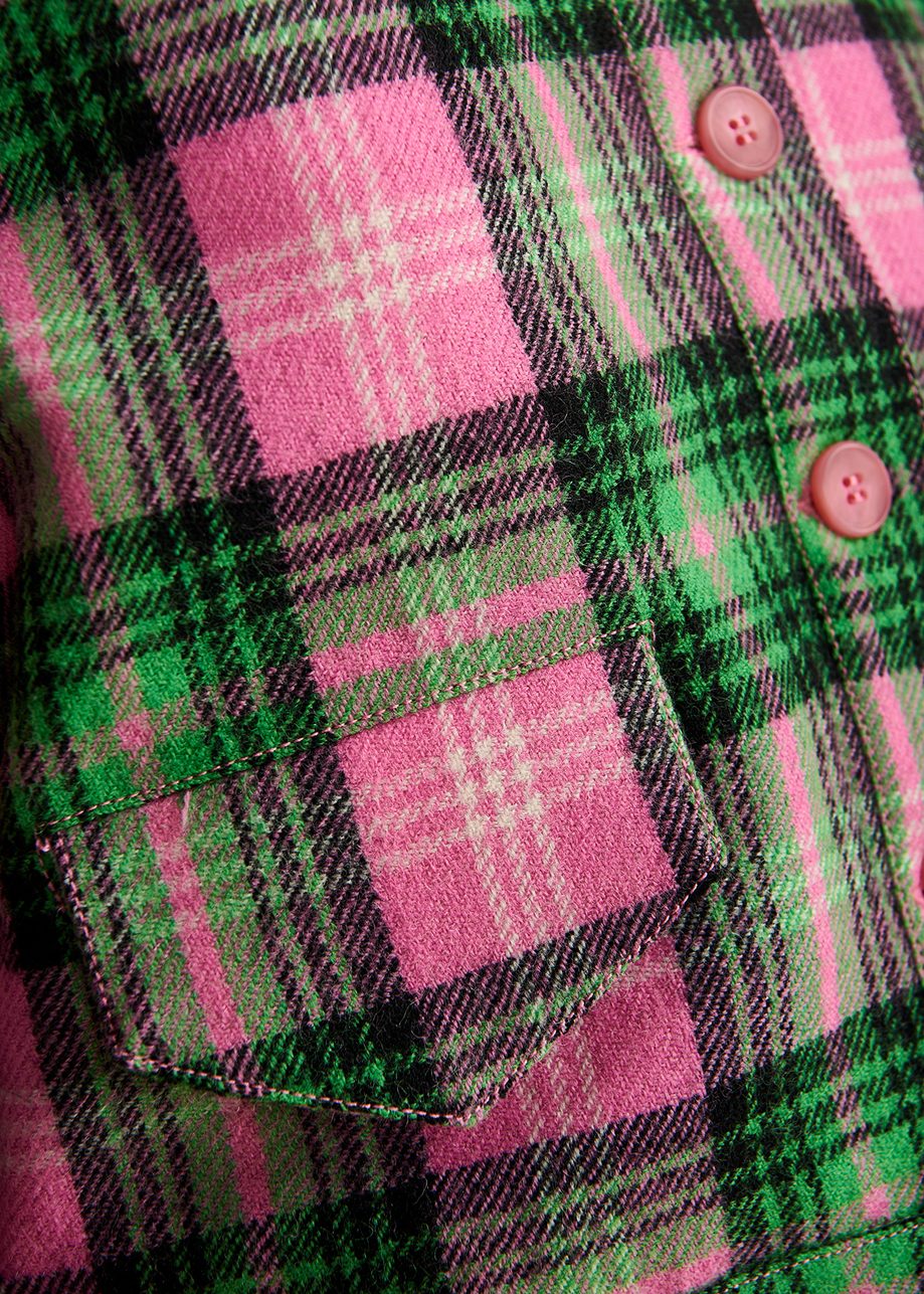 close up of the pink buttons on the pink, green and black checked jacket by essentiel antwerp