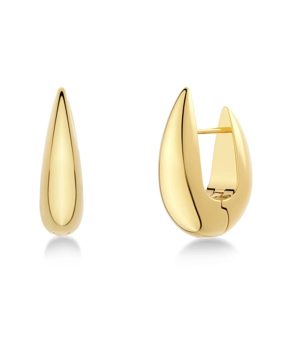 Close-up image of a pair of EDBLAD Crest Hoops L earrings with a polished, elongated teardrop shape design and 14K gold plating. One earring is closed, and the other is in an open position.