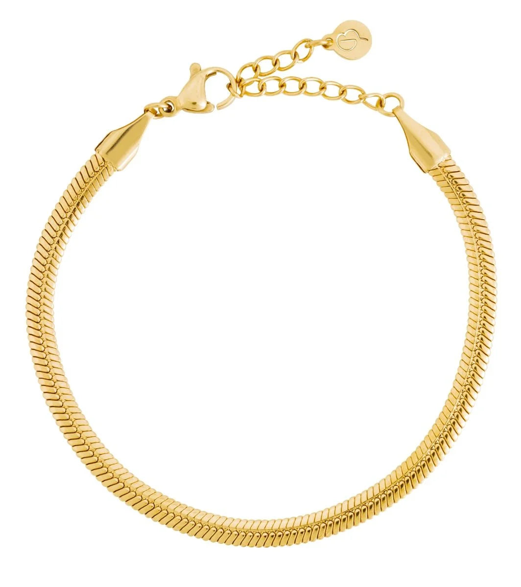 The Herringbone Bracelet by EDBLAD features a sleek, intricately woven design with 14K gold plating, a secure clasp, and an adjustable chain adorned with a small round charm.