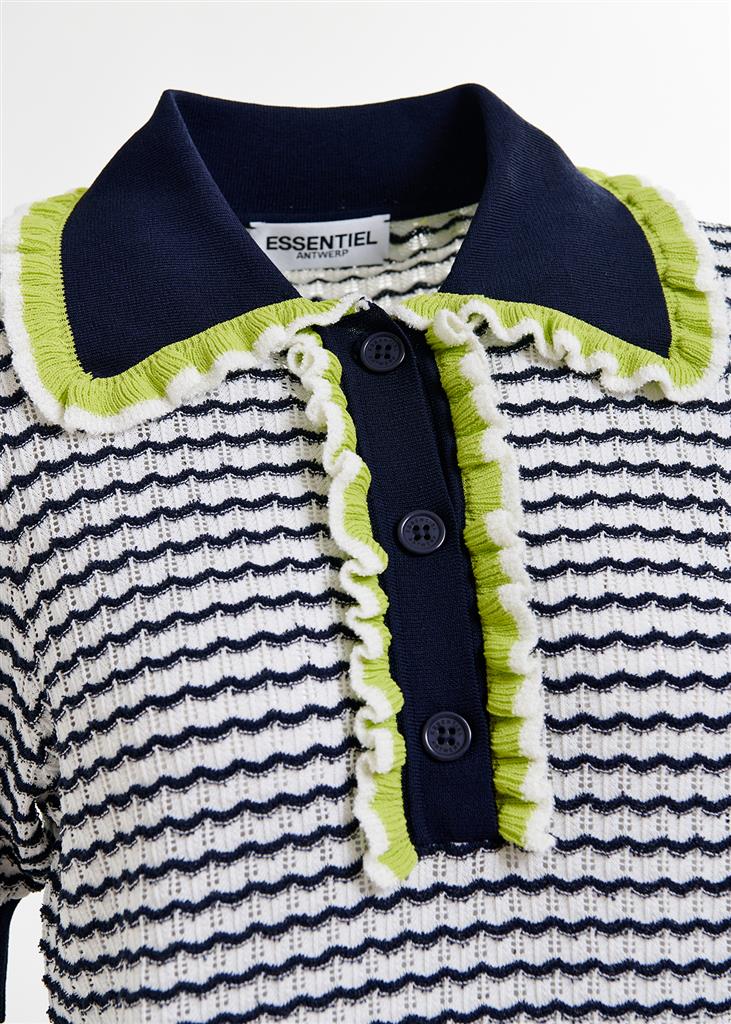 The Haximum Ruffled Polo by Essentiel Antwerp features a navy and green collar, three navy buttons, ruffled trim details, and offers a relaxed fit.