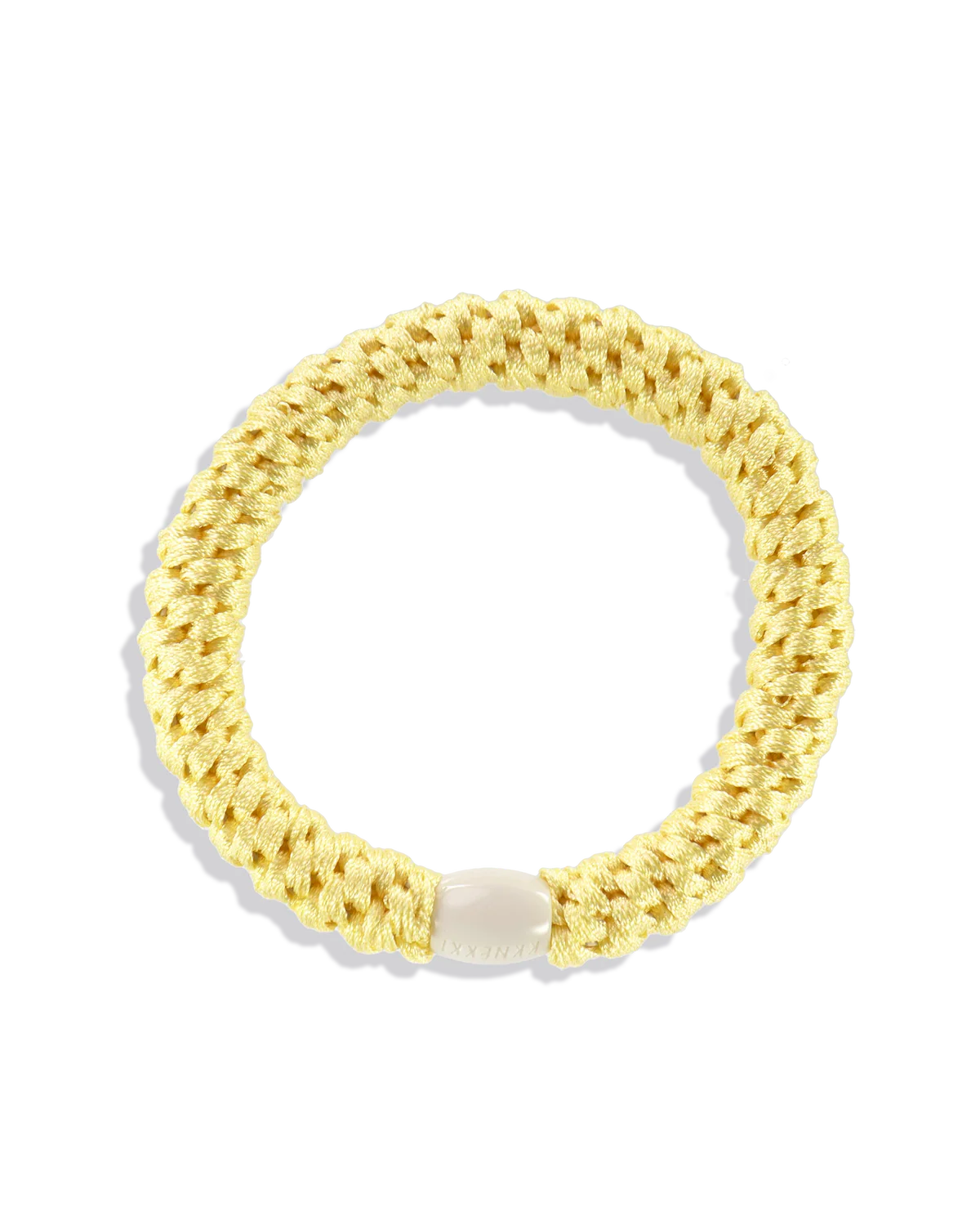 The KKNEKKI Hair Tie - Original is a yellow, braided hair tie with a white clasp, offering a gentle grip and waterproof design, shown on a plain white background.