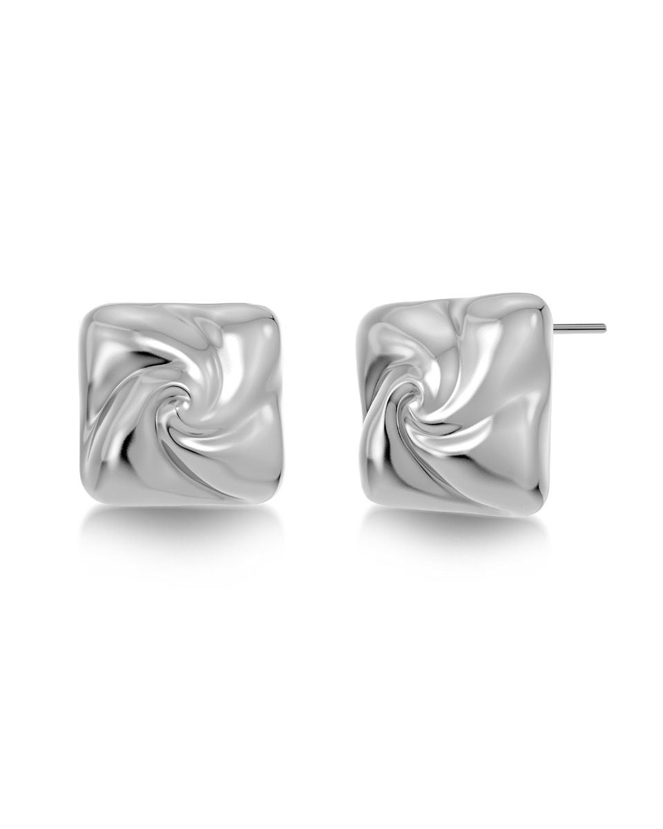 Introducing the Milky Way Studs S by EDBLAD: A pair of silver, square-shaped swirl-pattern stud earrings with a polished surface, enhanced by 14K gold plating. These statement studs are perfect for making a style statement reminiscent of the Milky Way's brilliance.