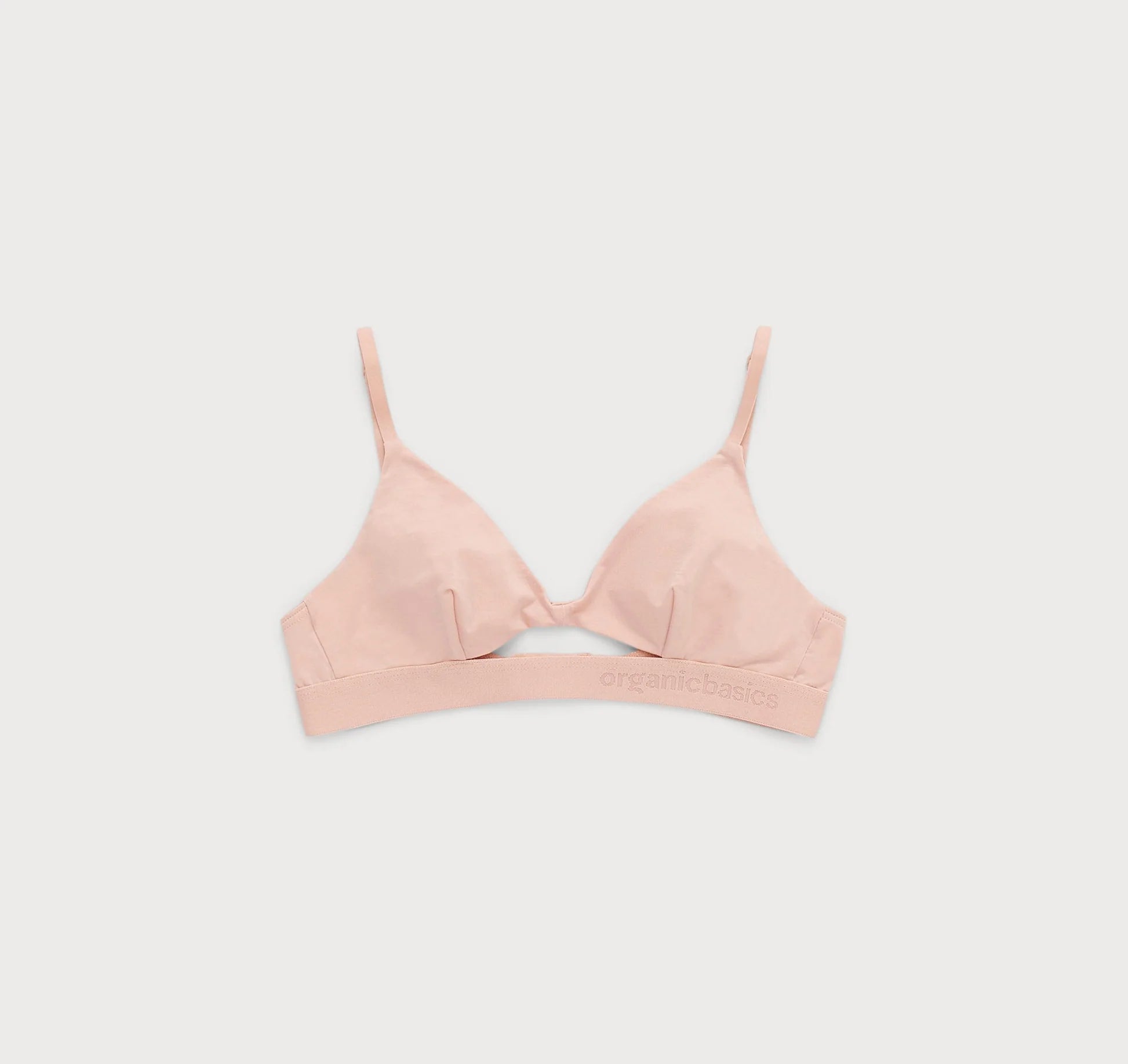 A comfortable and adjustable Soft Touch Bralette - Soft Pink with a bow on the back from Organic Basics.