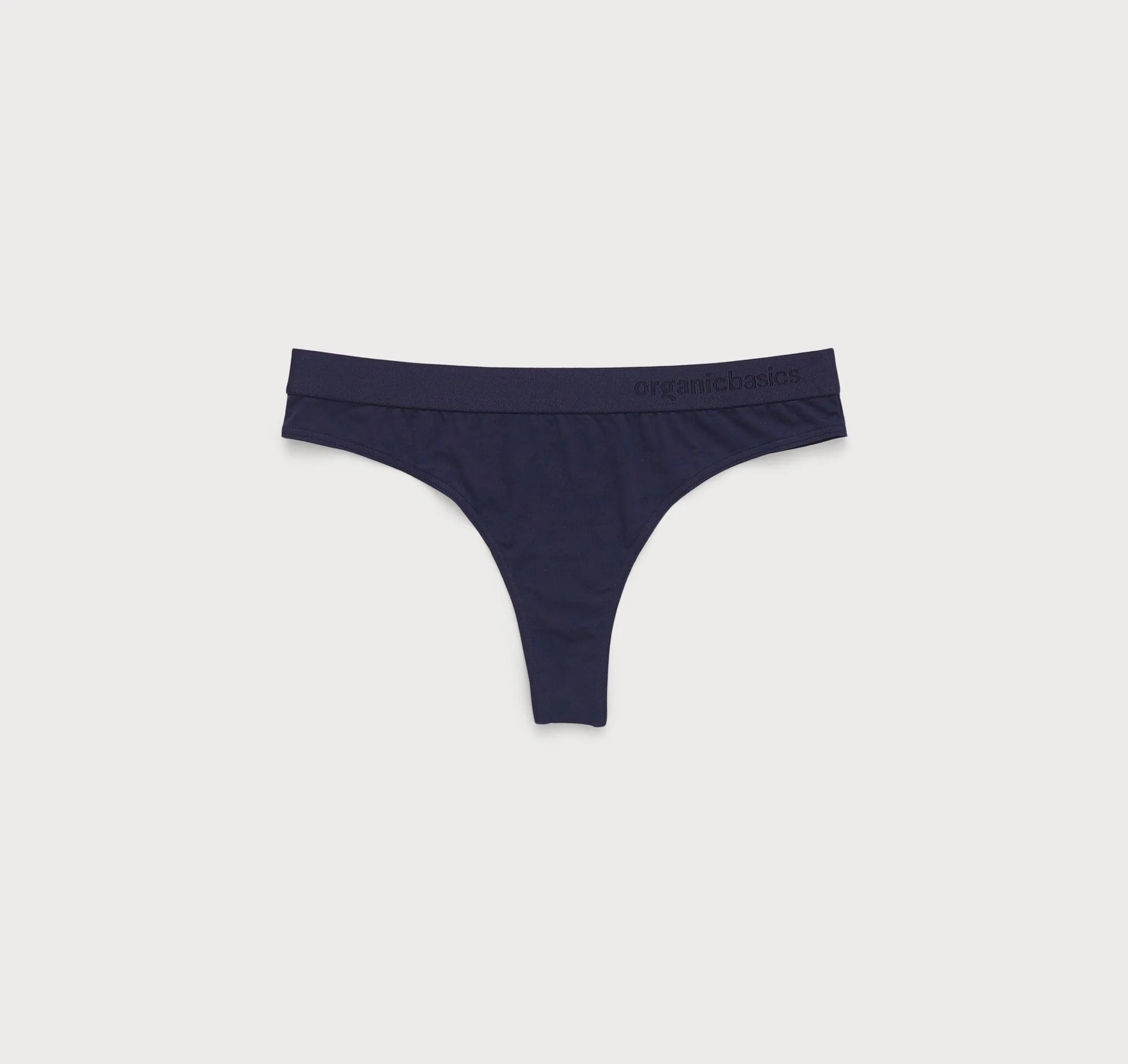 A sustainable pair of Soft Touch Tanga 2-Pack - Navy thongs on a white background by Organic Basics.