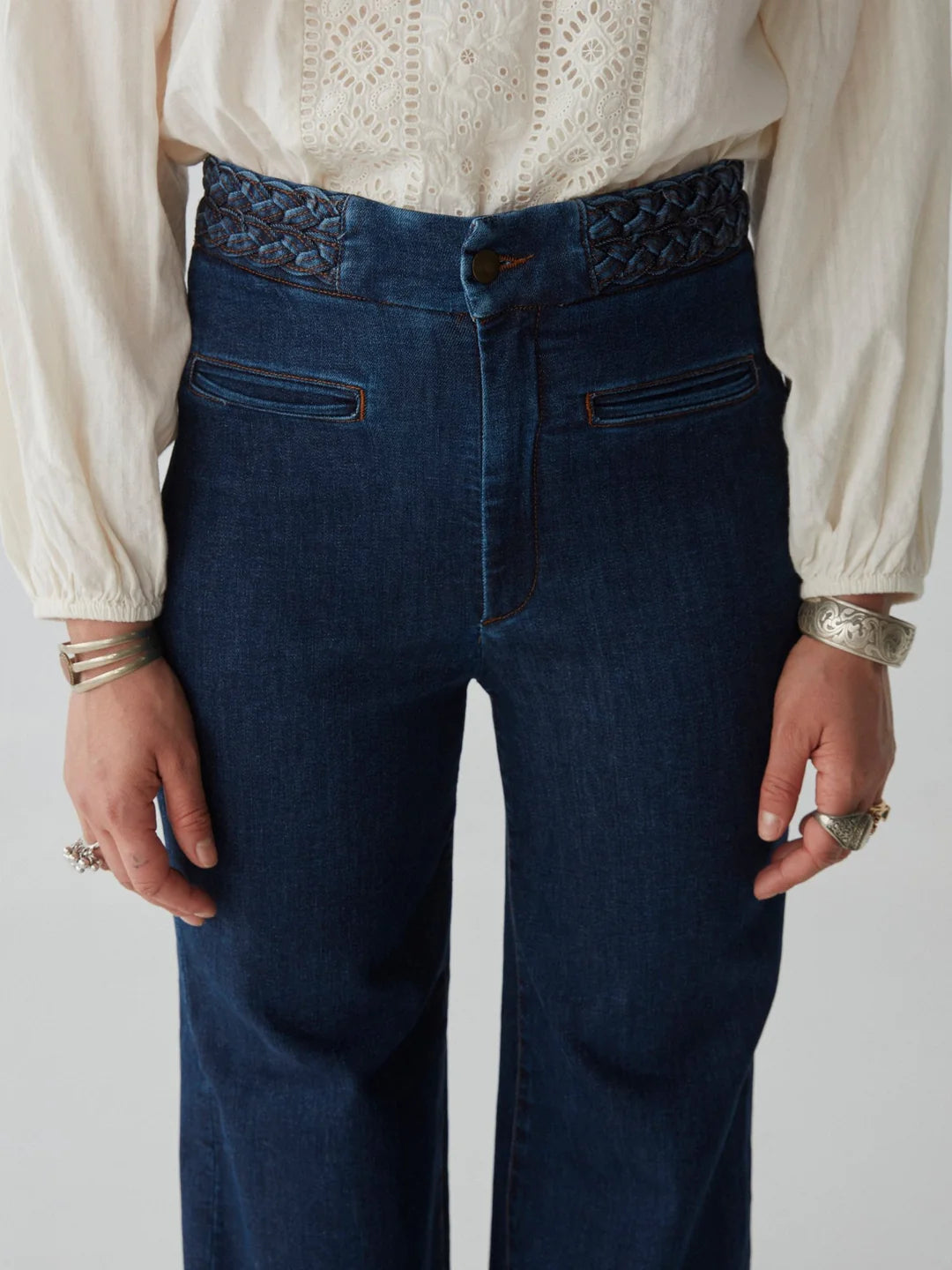 woman wears blue jeans by maison hotel