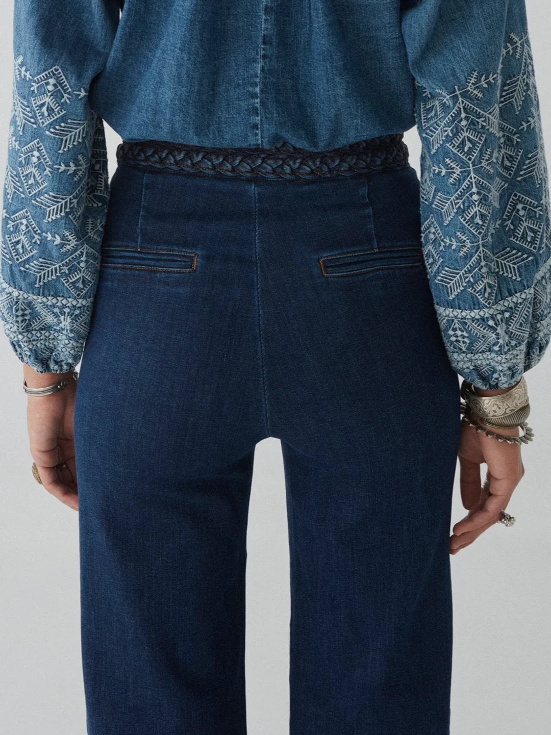 woman wears blue jeans by maison hotel