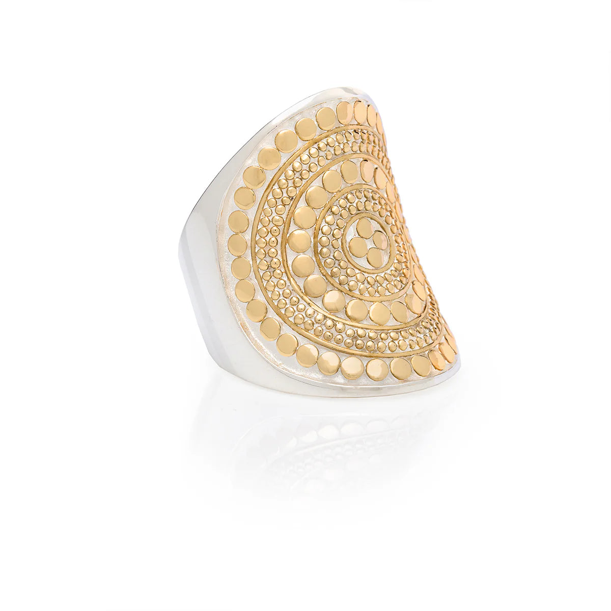 A Classic Saddle Ring - Gold by Anna Beck, crafted in sterling silver with a wide, triangular band adorned with intricate gold dots on a silver base.