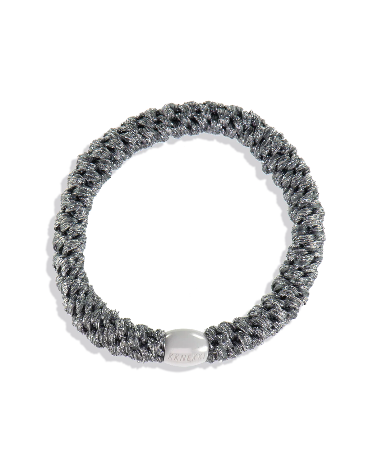 The KKNEKKI Hair Tie - Original features a coiled gray and black design with a silver metallic clasp, offering a gentle, waterproof grip for all-day comfort against a plain white background.
