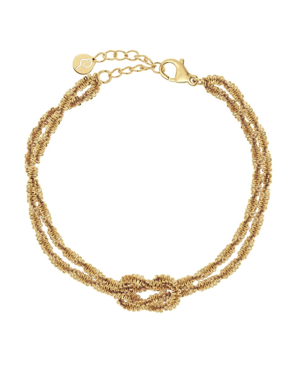 The Tinsel Chain Bracelet by EDBLAD is a gold double-strand bracelet with a knot design and clasp closure, featuring a small round charm and 14K gold plating, adding a touch of festive sparkle.