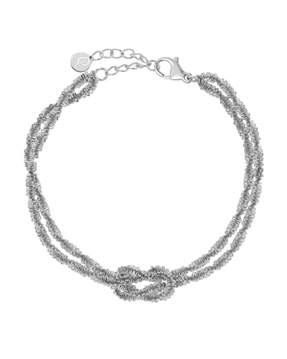 The Tinsel Chain Bracelet by EDBLAD is a silver accessory that offers festive sparkle, featuring a double chain design with a twisted knot detail and a secure lobster clasp.