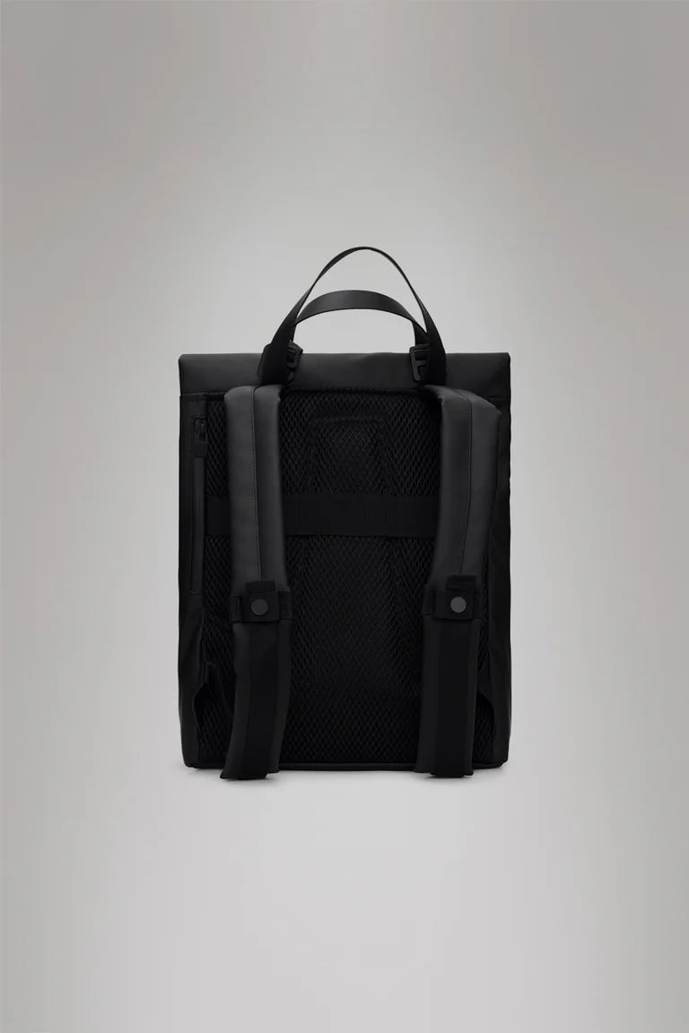 The Rains 2 Way Tote Backpack in black is shown from the back, with adjustable padded shoulder straps, a top handle, and a mesh back panel, set against a plain light gray background.