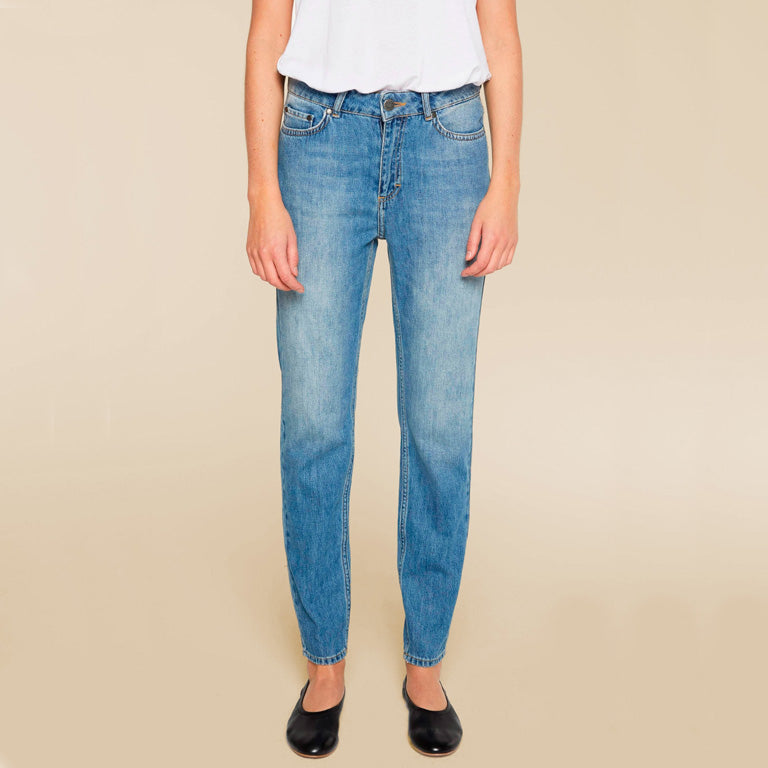 A woman wearing Sarah Jeans - Mid Blue from Twist & Tango.