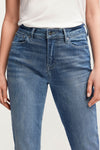 Woman wears Denham Margot jeans