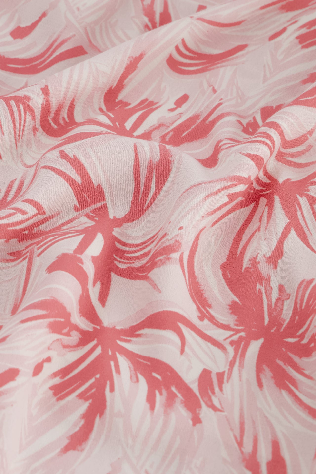 A close up of the Eline Top - Palmeraie Mini by Fabienne Chapot, a pink floral print fabric.