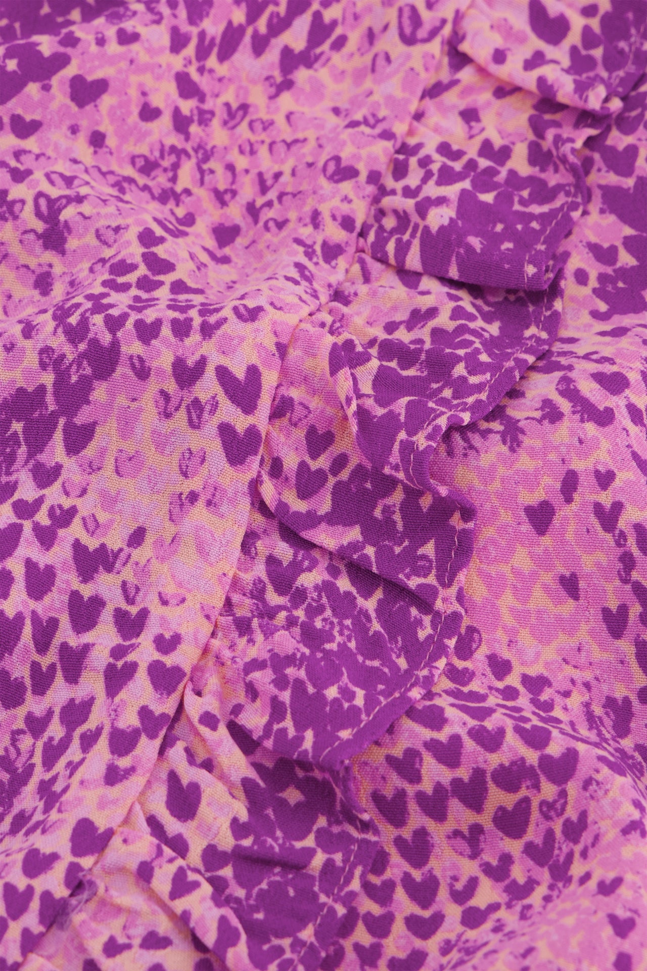 A close up of a Fabienne Chapot Channa Dress in Magic Magenta snake print.