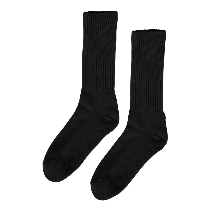 Black thick ribbed socks against a white background 