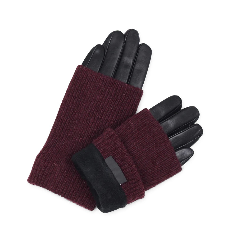 A pair of Helly Leather Gloves - Black/Burgundy by Markberg, with black cuffs, crafted using sustainable leather production methods.