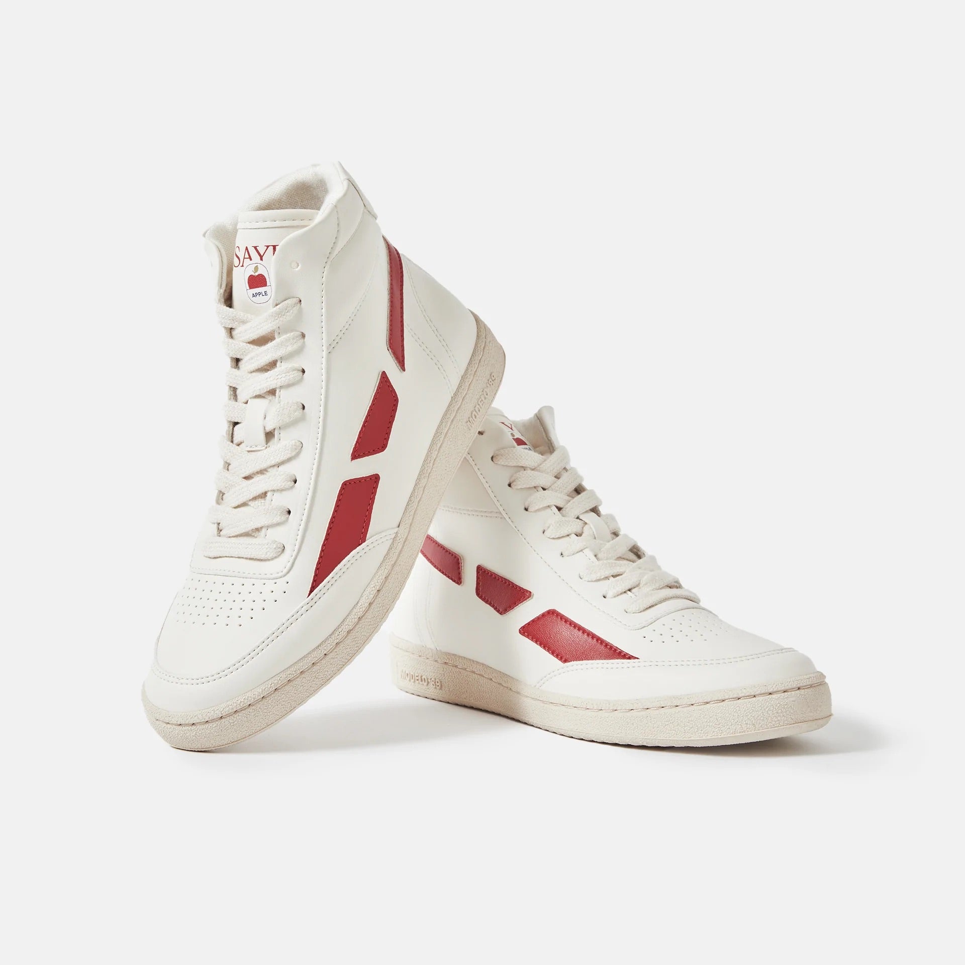 A pair of SAYE Modelo '89 Hi Sneakers - Apple with bamboo lining on a white surface.