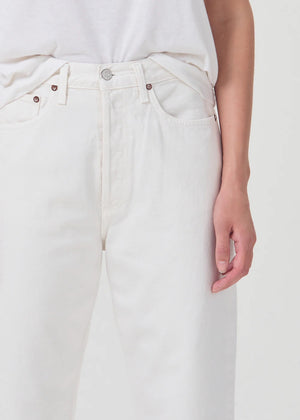 Woman wears Agolde 90's pinch crop in white
