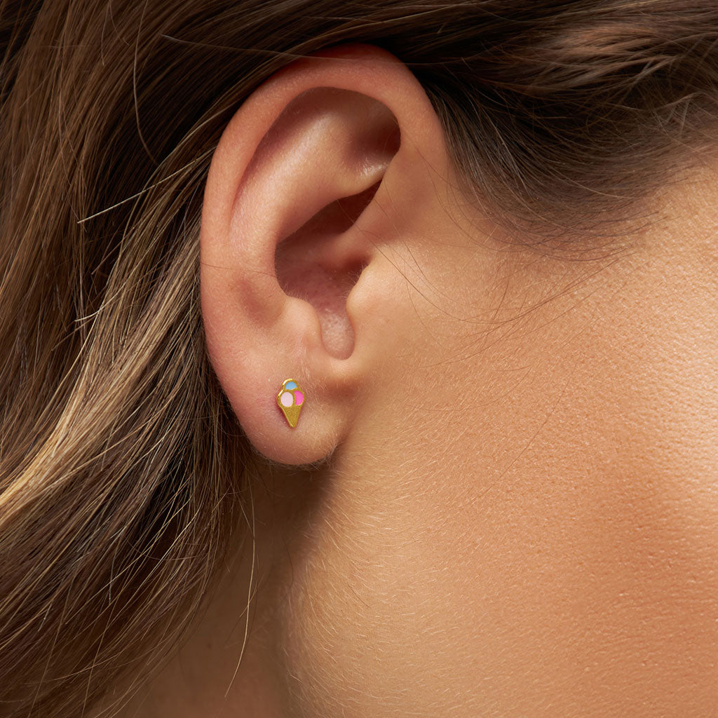 A woman's ear with a Lulu Copenhagen Ice Cream Cone Single Stud earring.
