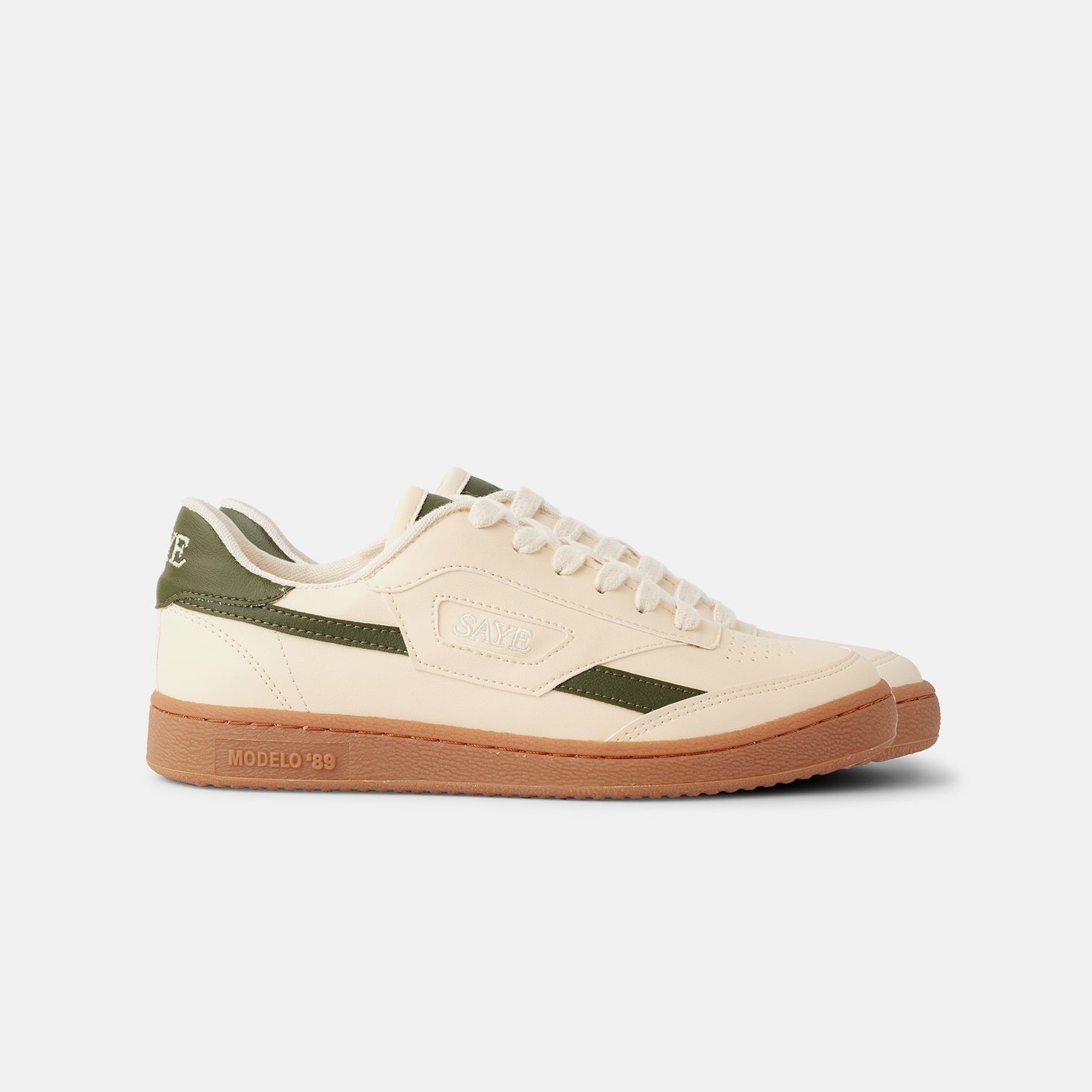 A white and green Modelo '89 Sneaker from the SAYE Greens Capsule collection on a white background.