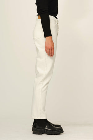 Woman wears teresa slim leg jean in off white 