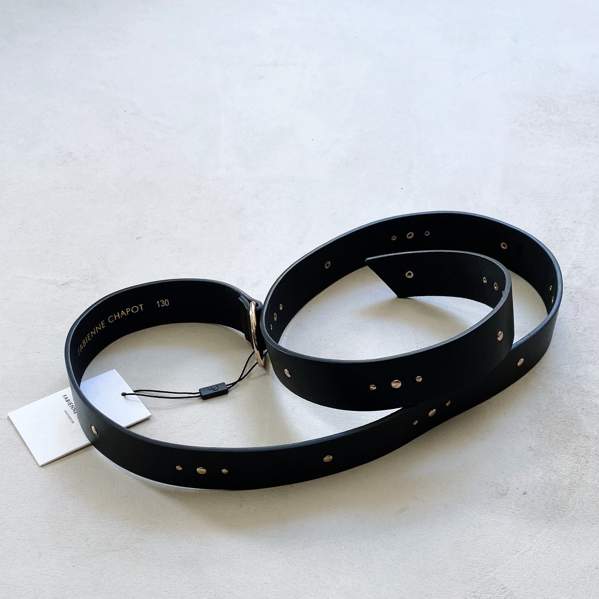 A Fabienne Chapot studded belt - black with gold studs.