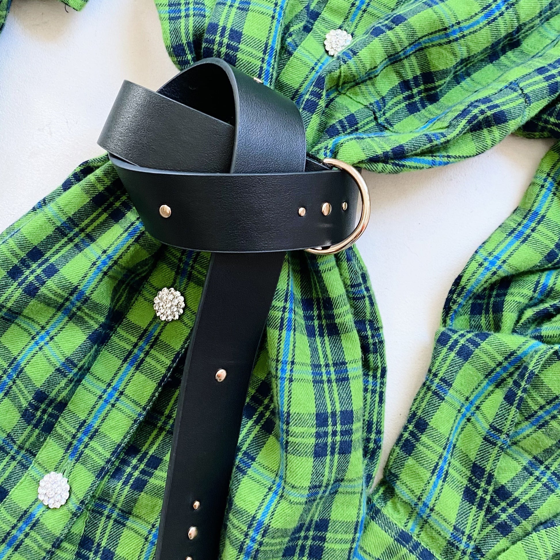 A self-tie green and black plaid shirt with a Fabienne Chapot Studded Belt - Black.