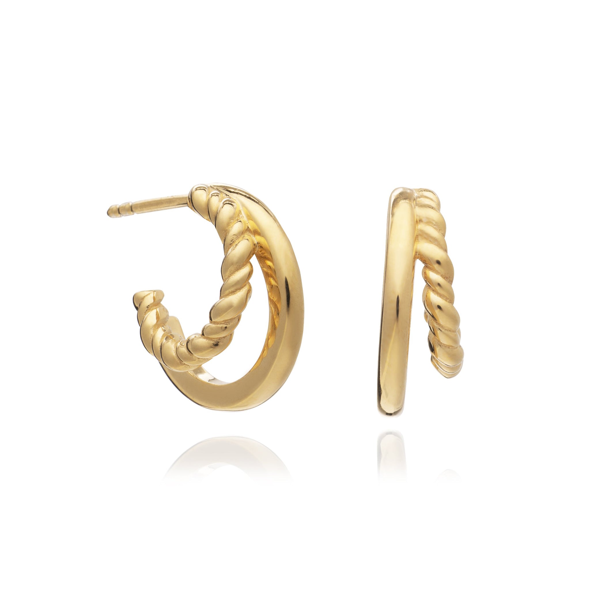 A pair of Illusion Huggie Hoops - Gold by Rachel Jackson London, perfect for stacking in a jewellery box.