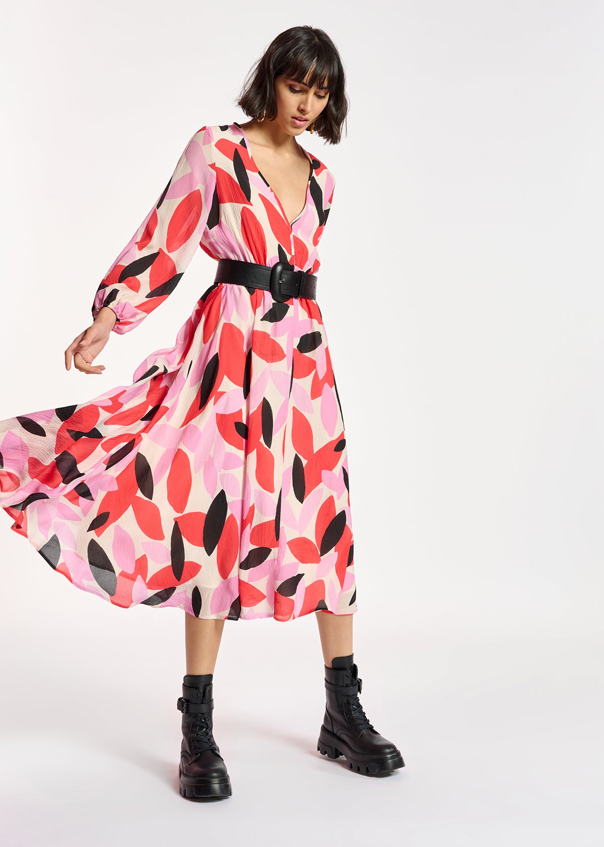 The model is wearing a luxurious Crab Puff Sleeve Dress - Multi by Essentiel Antwerp in a pink and black floral print.