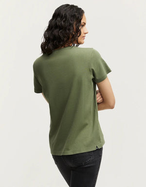 person wears the denham khaki ramona v-neck tee against a grey studio background showing the back of the Tee. 